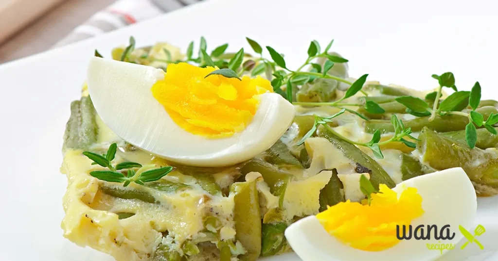 Mixing edamame, chopped eggs, and creamy dressing in a large bowl for the edamame egg salad recipe.