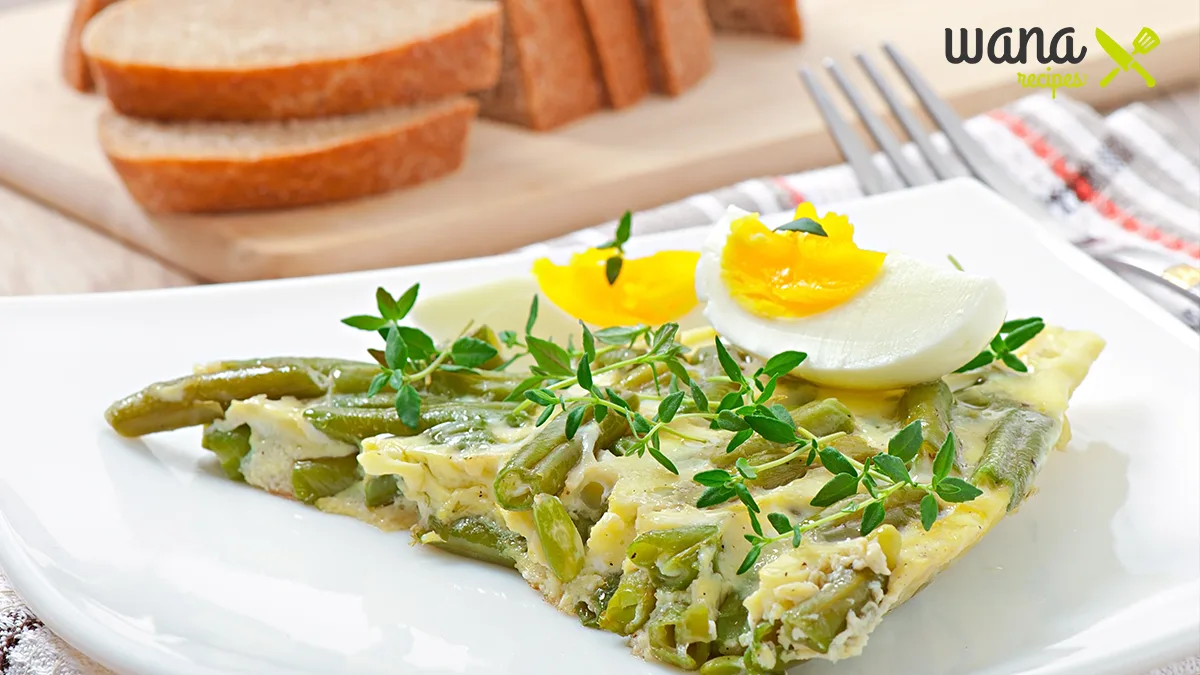 Fresh edamame egg salad served in a bowl with a garnish of herbs and sesame seeds.