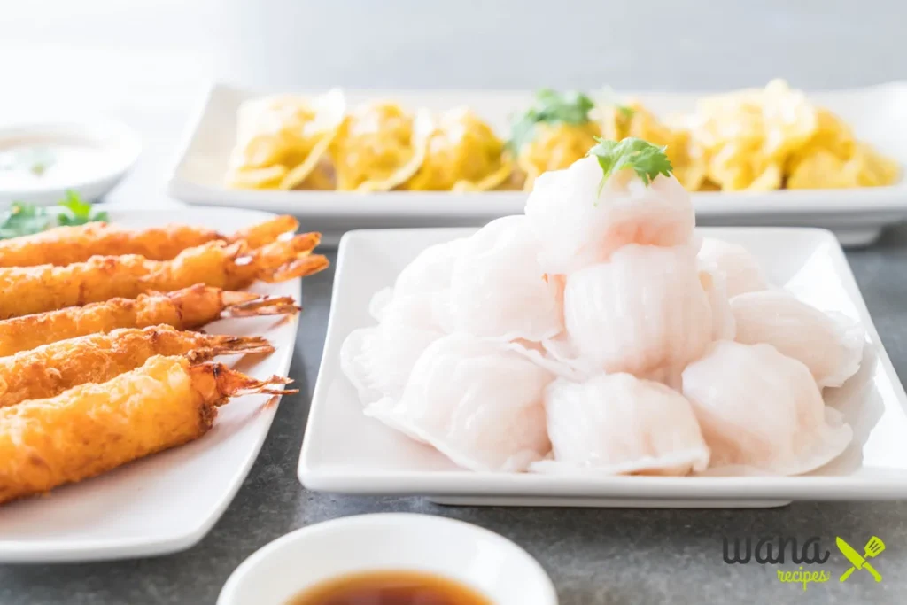 Dim sum platter with shrimp dumplings, fried shrimp, and wontons.