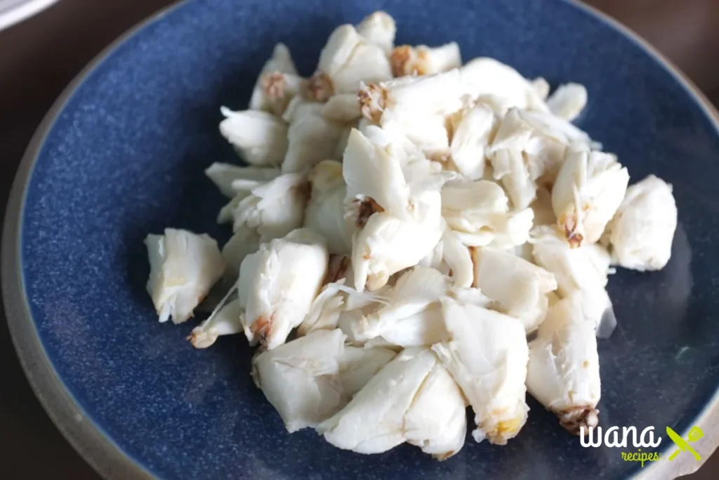 Jumbo lump crab meat pieces served in a blue bowl