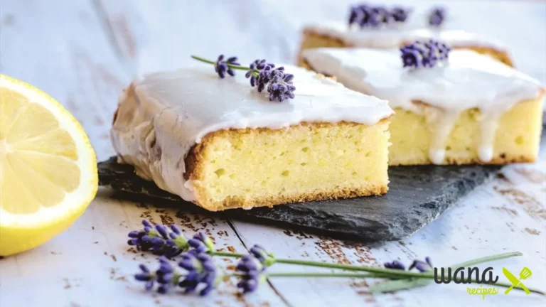 Moist and fluffy kefir sheet cake topped with cream cheese frosting, served on a white plate with a fork.