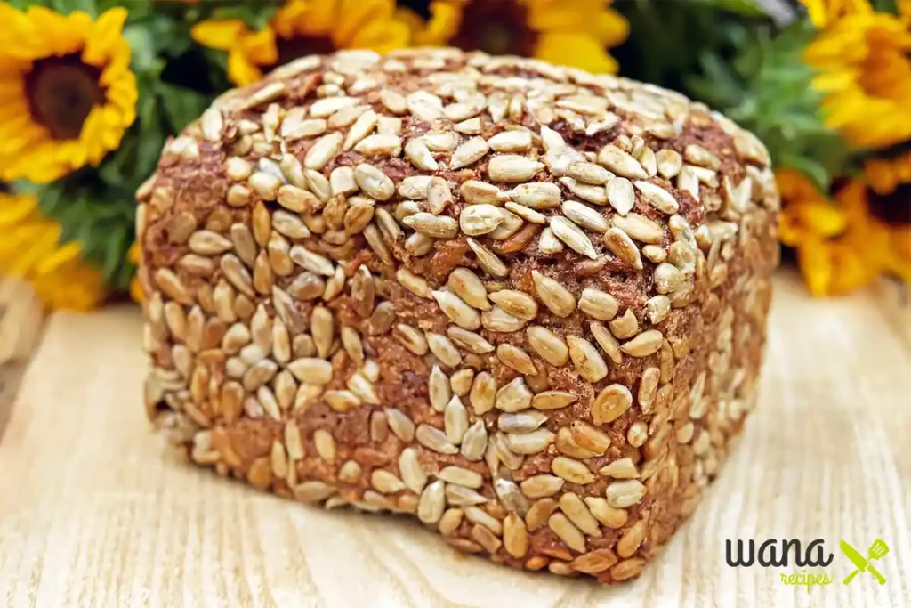 Sunflower pumpkin seed bread with a golden crust – Topped with crunchy sunflower seeds, this rustic loaf is both delicious and nutritious.